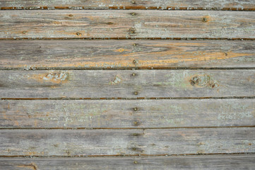 Wood plank wall with peeling paint background texture.