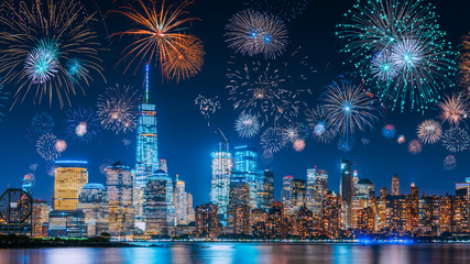 New Years Eve with colorful Fireworks over New York City skyline long exposure with beautiful dark...