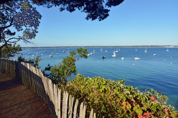 Coastline and boats of Beg Meil, a French peninsula, surrounded to the east by the bay of La Forêt...