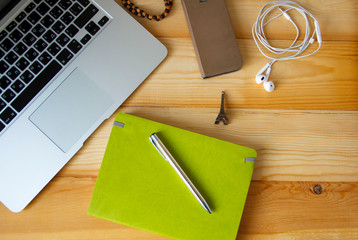 Computer and a notebook on the table