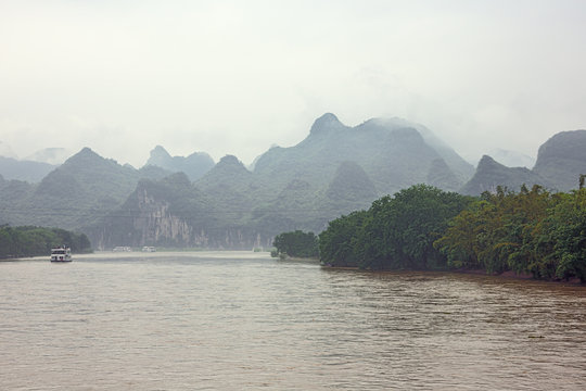 River cruise boat near the Mopanshan wharf navigating on the Li River near Guilin
