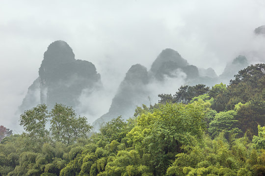 Mysterious clouds covering the hills bordering the Li River in the vicinity of Yangshuo near Guilin