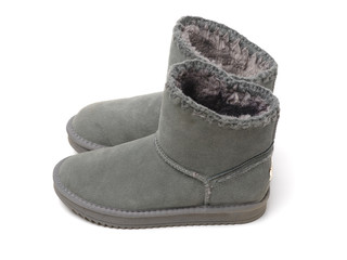 Pair of female grey grunge style boots isolated on a white background