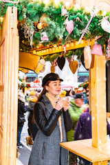 Girl enjoys smell of mulled wine with pleasure