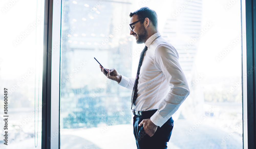 Aufkleber side view of mature trader dressed in formal wear reading message with positive information about bu