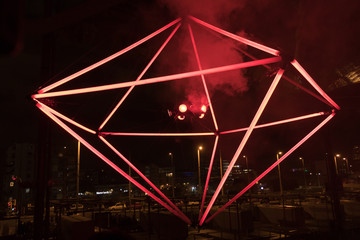 Decorative lighting with tubelights in the open street depicting  shape of a polygon