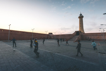 Kids playing Soccer by the Rabat Lighthouse - Morocco