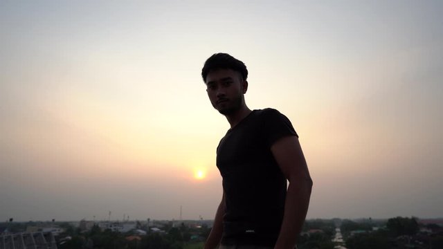 shadow of male photographer take photo in evening river city and forest sunset background view stock footage