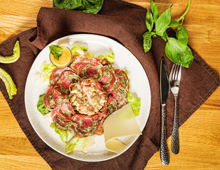 carpaccio with salad on the table