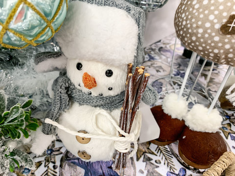 Decorative textule funny snowmen on a shelf at christmas market fair in mall