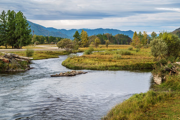 Morning mountain landscape with a river. Autumn in the Karakol River Valley, Altai Mountains, Russia