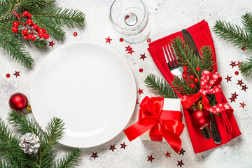 Christmas table setting on white top view.