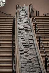 Water flows over rocks and brick structure