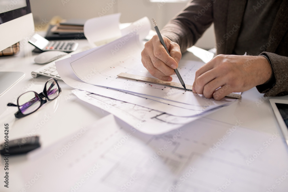 Poster Hands of architect with pencil and ruler drawing line while working over sketch