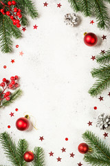Christmas background with fir tree and decorations on white.