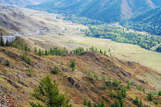 Serpentine mountain road. View of the Chuysky tract from the Chike-Taman pass, Altai mountains, Russia
