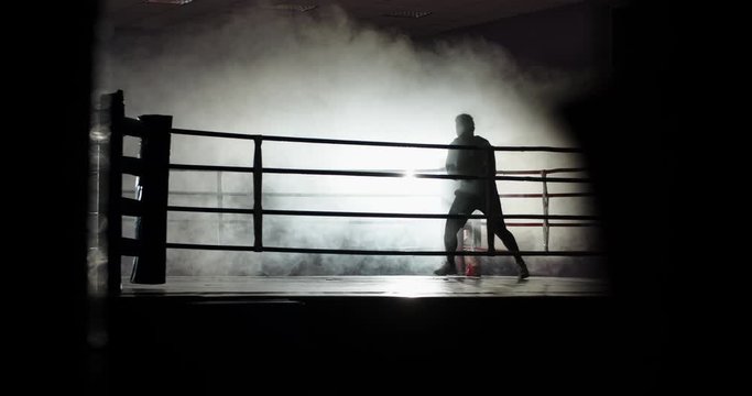 African american sportsman exercising on a boxing ring, doing a shadow fight, preparing for tournament - sports, fitness concept 4k footage