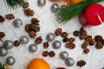 Fir branch and artificial snow along with Toys on white background. New Year and Christmas background.