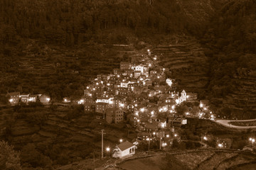 Sepia toned Small remote schist village Piodao on the side of the mountain, Arganil Portugal