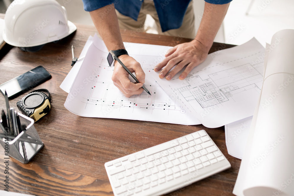 Poster Hands of modern engineer with pencil drawing sketch of building construction