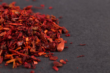 Crushed paprika close-up, macro, on the table. Copy space.