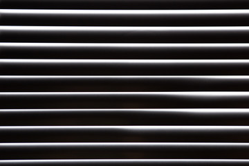 Abstract background for wallpaper in the form of black and white straight horizontal lines.