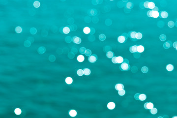Aquamarine background with blurred lights and bokeh