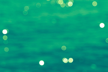 Aquamarine background with blurred lights 
