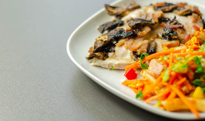 Chicken breast with sliced mushrooms, ham, in cheese sauce with pasta salad