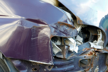 Car parts are damaged by a road collision