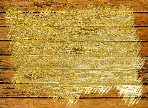 The background image of old boards covered with peeling yellow paint from under which boards with a metallic gold sheen come out
