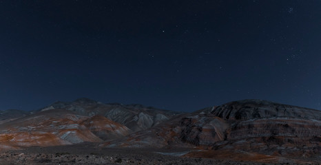 Red mountains on a moonlit night