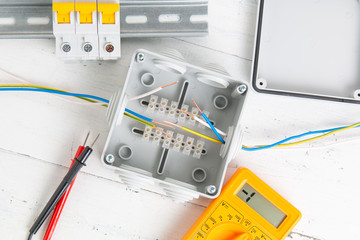 electrical outlet, switch, circuit breakers, cutting box and digital multimeter. installation of...