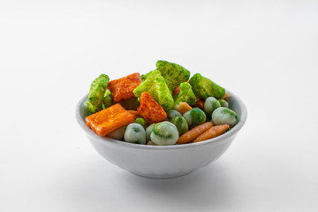 Japanese hot appetizers with peas and wasabi lie in a white bowl on a white background