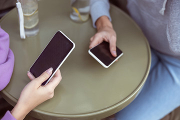Focused photo on female hand that holding telephone