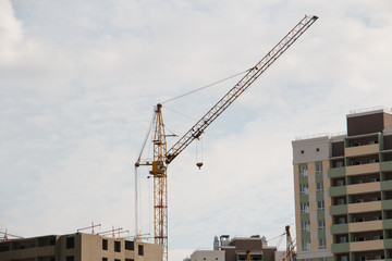 building a house neighborhood tower crane in operation