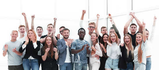 team of happy young people showing their success