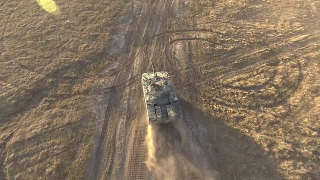 Stock footage video war tank rides aerial view.