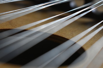 close up of strings on dulcimer
