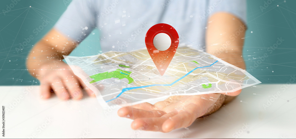 Poster man holding a 3d rendering pin holder on a map
