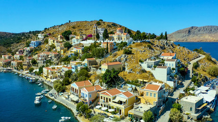 Simi island Greece view from the drone on the colorful houses and Bay of the sea with ships