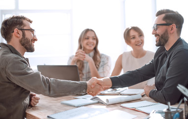 handshake business people at a meeting in the office