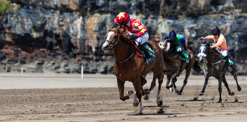 panorama of horse racing on the beach on the west coast of Ireland