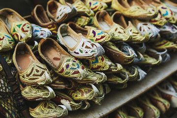 Traditional arabic shoes on the local market bazaar in Dubai.