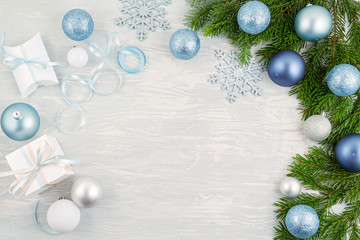 Festive christmas background with blue and silver xmas decoration and gifts