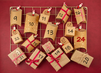 Advent calendar with craft carton boxes on the mesh board