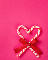 Christmas Candy Cane Heart on a Pink background