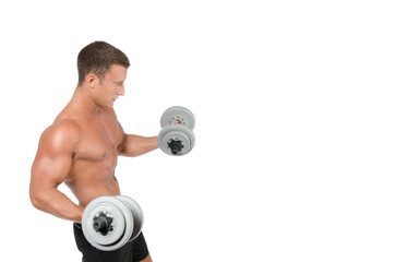 Fitness and healthy lifestyle. Young attractive guy at the gym.