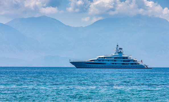 Large luxury white yacht off the coast of Crete, Greece.