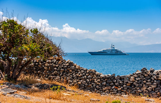 Large luxury white yacht off the coast of Crete, Greece.